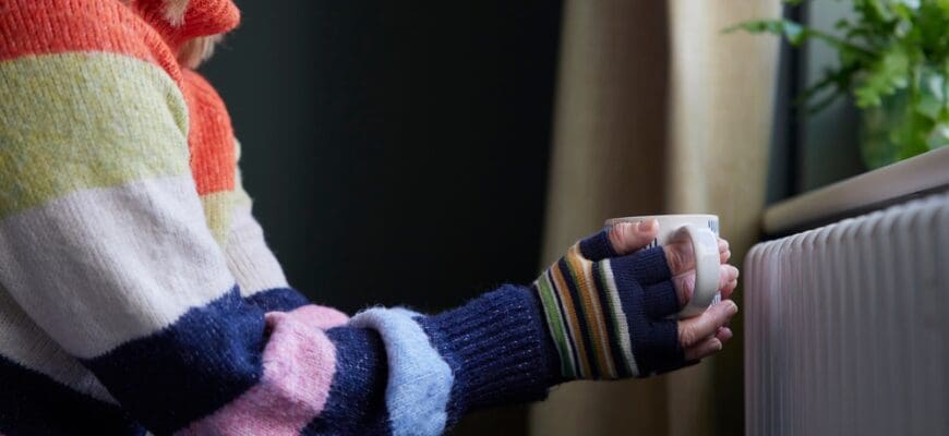 Woman,In,Gloves,With,Hot,Drink,Trying,To,Keep,Warm